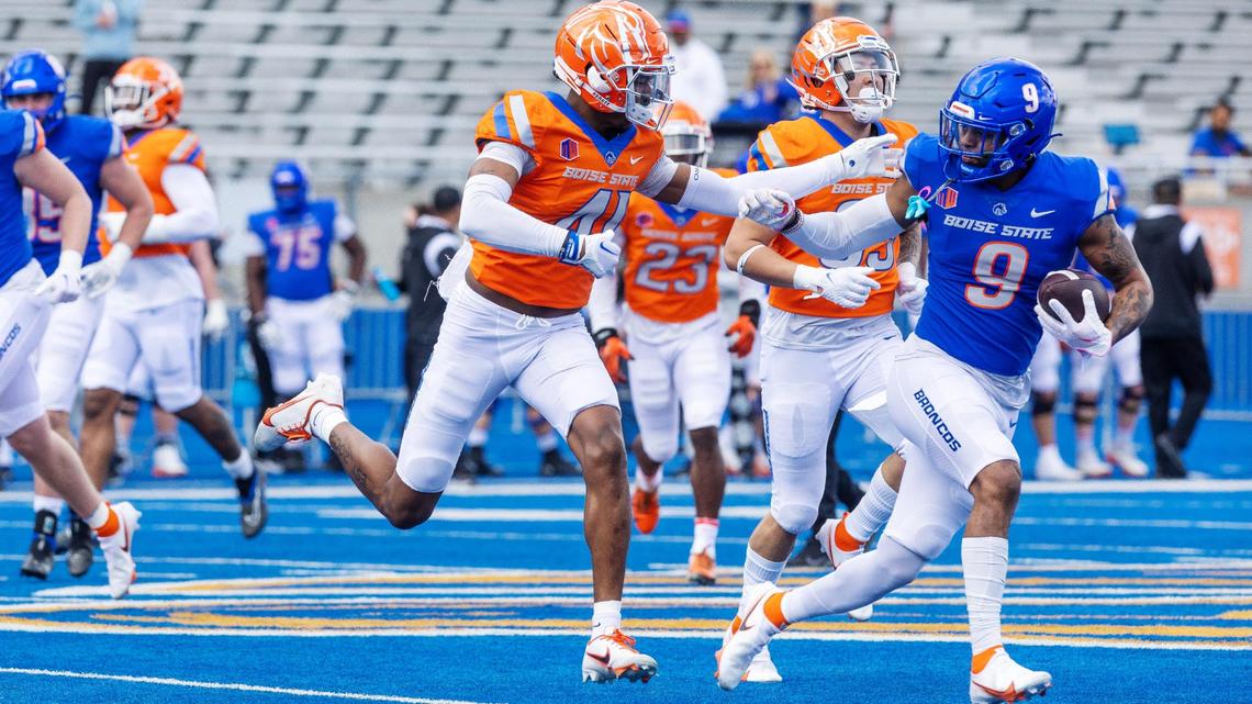 Boise State cornerback Jaylen Clark stays on wide receiver Shea Whiting after Whiting makes the catch during the Broncos’ spring game at Albertsons Stadium, Saturday, April 8, 2023.