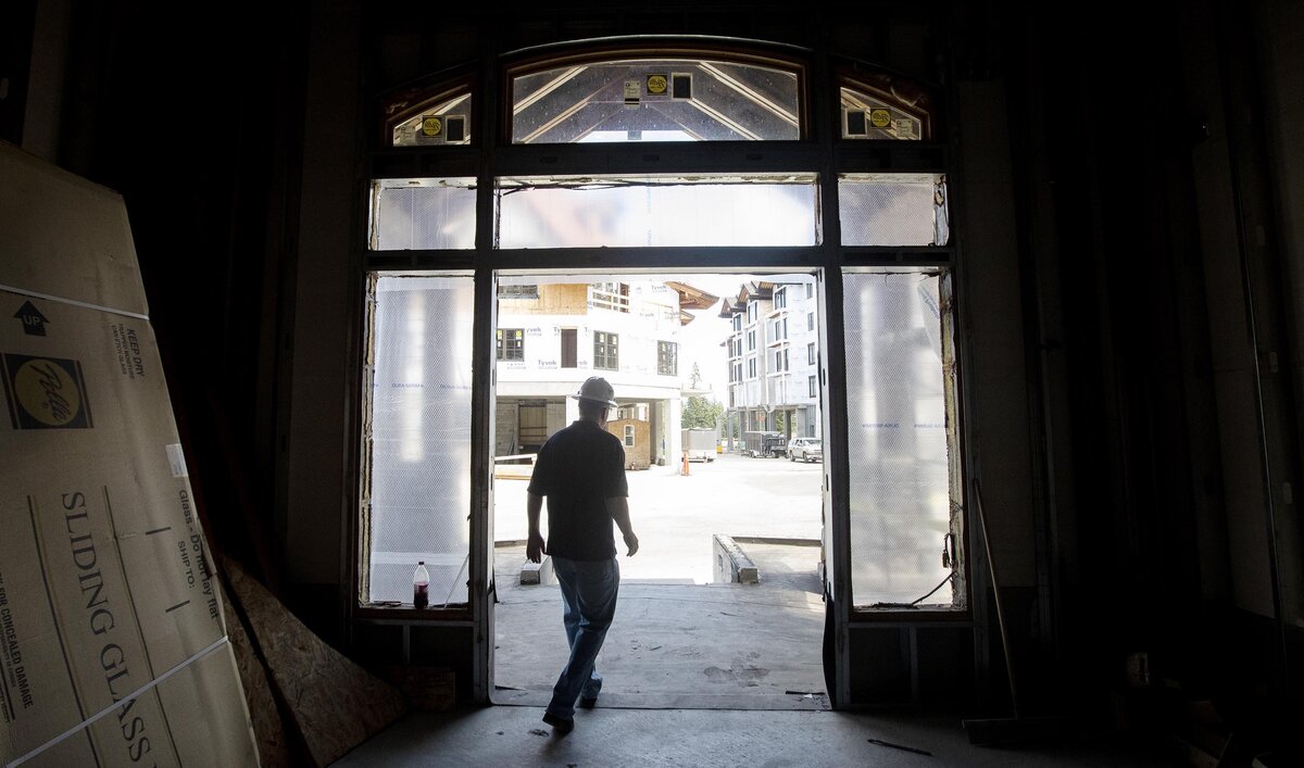 Doug Hodson, building manager at Tamarack Resort, exits the doorway of one of the condominium buildings that is being finished this year.