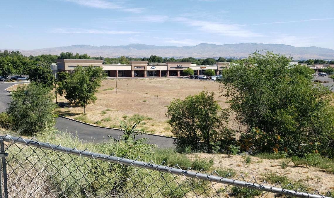 The Hillcrest Shopping Center has a number of vacant storefronts and last year was listed for sale. Empty ground in front of the center once housed a Grand Central department store that later became a Fred Meyer store. The building was demolished in 2011.