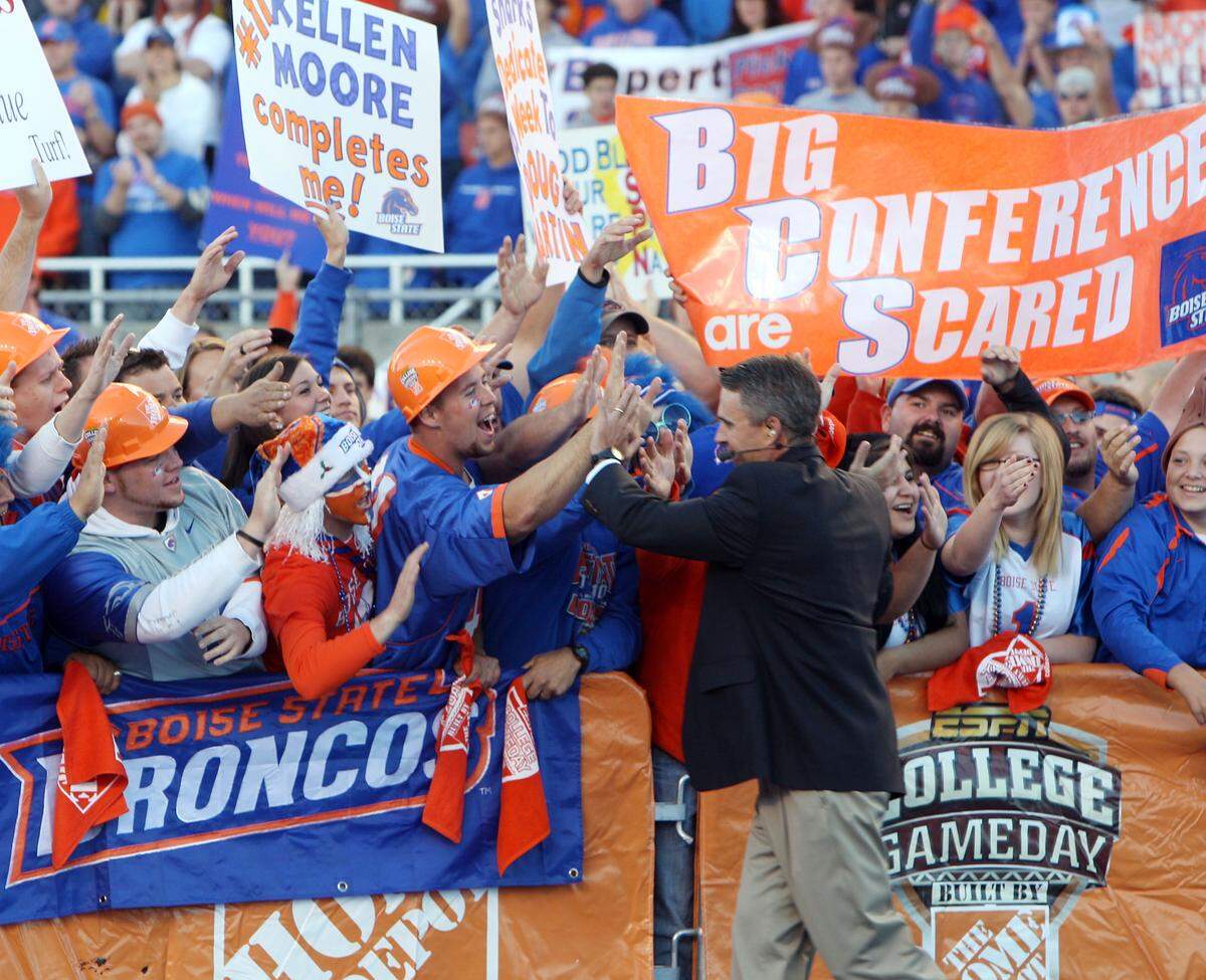 Boise State coach Chris Petersen greets fans before appearing on ESPN’s “College GameDay” show in 2010 at Bronco Stadium.