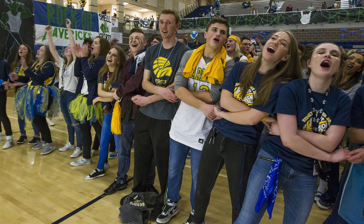 Meridian students gather on the Mountain View basketball court after the Warriors defeated the Mavericks 55-50 Tuesday, Jan. 22, 2019 at Mountain View High School. The students also won the Stinky Sneaker spirit award traded between the two Meridian schools each year.