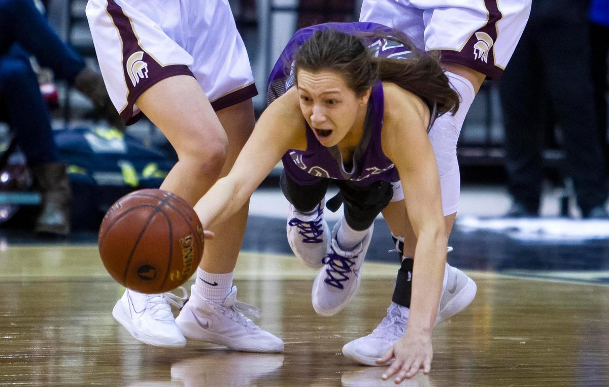 Rocky Mountain guard Jada Reed is fouled as Rigby tries to get the ball back in the waning seconds of the first-round game Thursday, Feb. 20, 2020 in the 5A state girls basketball tournament at Ford Idaho Center in Nampa.