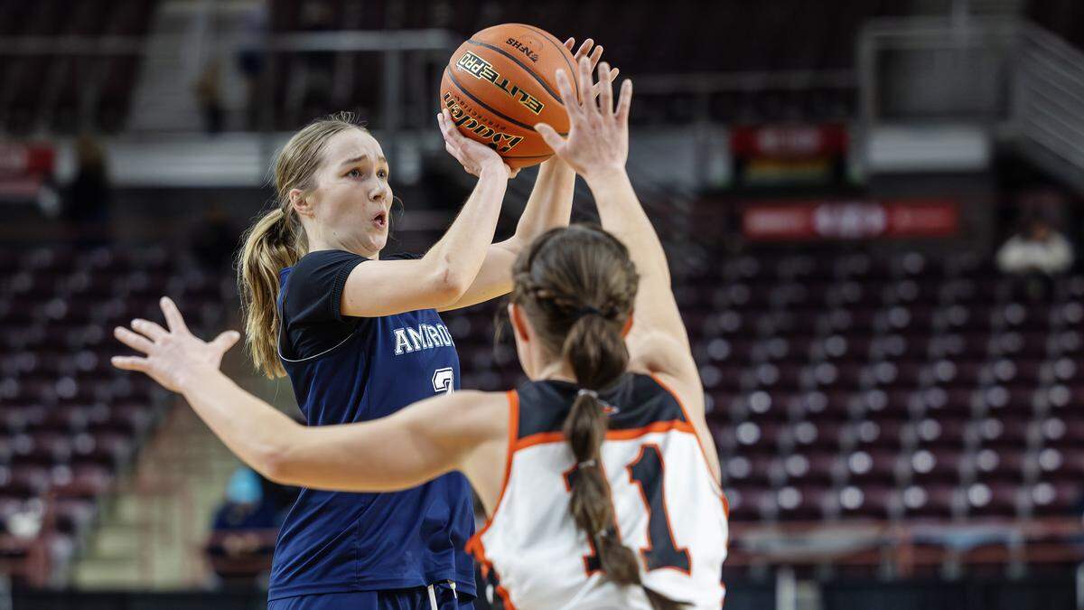 Ambrose junior Annelise Curran shoots over Malad senior Mikell Keetch in the first half of their game in the 3A state championship at the Ford Idaho Center in Nampa, Saturday, Feb. 21, 2026.