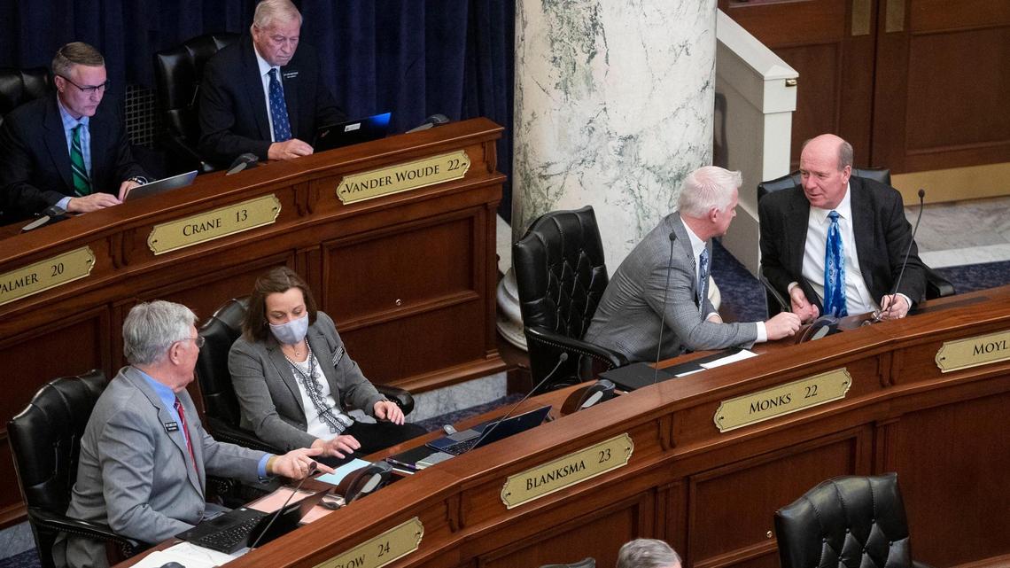 House Majority Leader Mike Moyle, R-Star, talks with Assistant Majority Leader Jason A. Monks, R-Meridian, on Jan. 29 on the floor of the Idaho House.