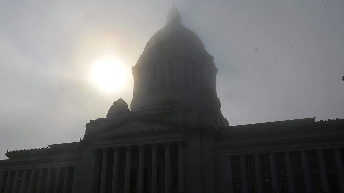 The State Capitol dome in Olympia is barely visible around mid-morning on Tuesday, courtesy of a thick blanket of stubborn wildfire smoke currently enveloping the region.