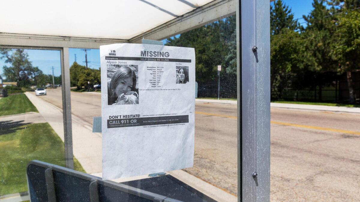 A poster on a bus stop in Boise gives information about Alyssa. She has long brown hair and stands 5 feet, 5 inches tall.