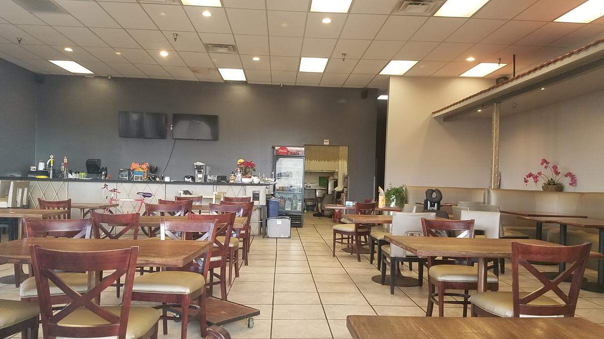 On a recent weekday, the room was lit if you looked through a window. But Pho Tay was closed.