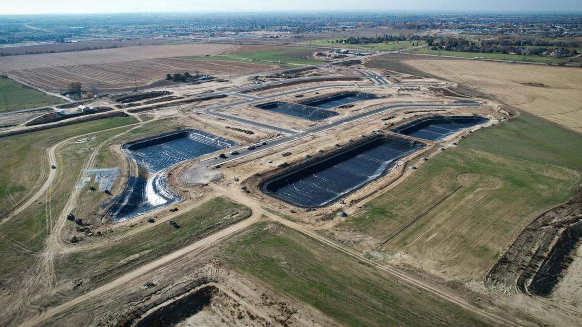 This aerial photo looking southwest shows construction of Terra View’s human-made lakes in center with the intersection of Highway 16 and Beacon Light Road near top right. Terra View South would be at top center.
