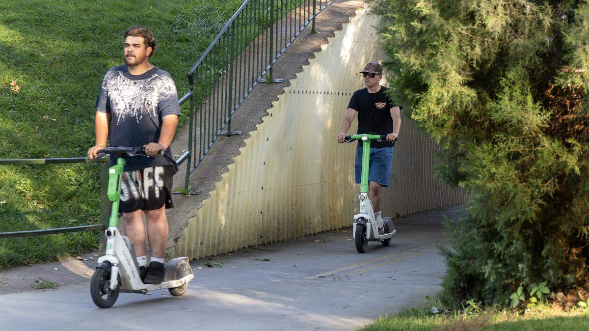 People ride Lime e-scooters on the Greenbelt in Boise, Saturday, August. 23, 2025.