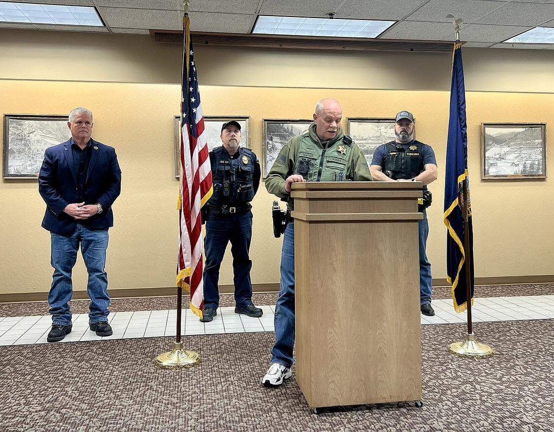 Shoshone County Sheriff William Eddy addresses reporters during a press conference on Friday night at the Wallace Inn. He was joined by, from left to right, Kootenai County Sheriff Bob Norris, Kellogg Police Chief Paul Twidt, Osburn Police Chief Jason Woody (standing behind Eddy), and Pinehurst Police Chief John Richter.