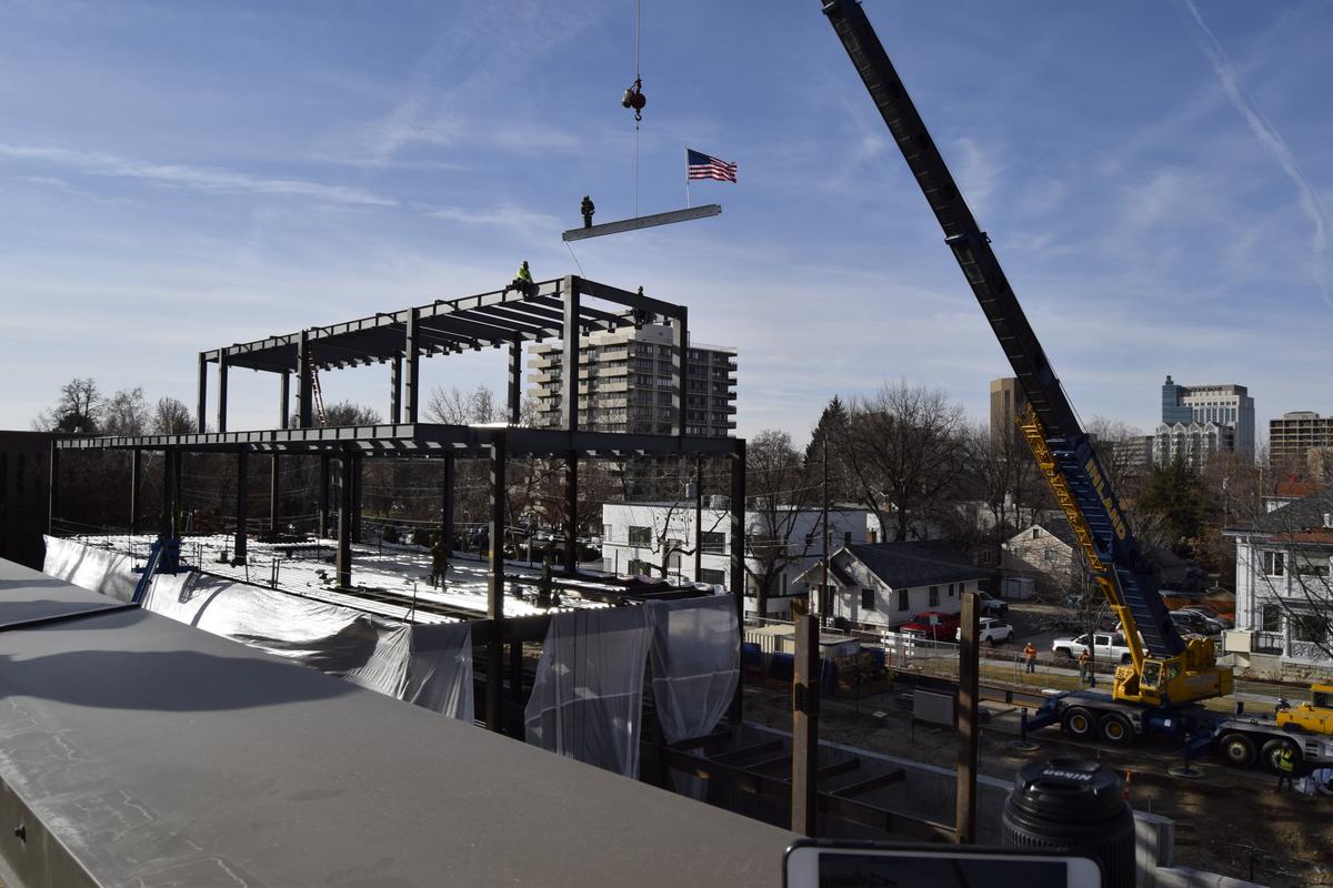 A crew from Layton Construction Co. uses a crane to set a steel beam at the shipping and receiving building under construction as part of the expansion of St. Luke’s Boise Medical Center. 