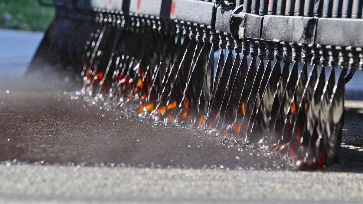 An Ada County Highway Department oil distributor applies a polymer-infused oil to a street while performing chip seal work in Boise in 2015. In Whatcom County, Slater Road is scheduled for chip seal work this week and next.