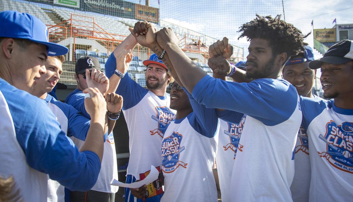 John Molochon, center, led the offense in Boise State football’s annual charity softball game.