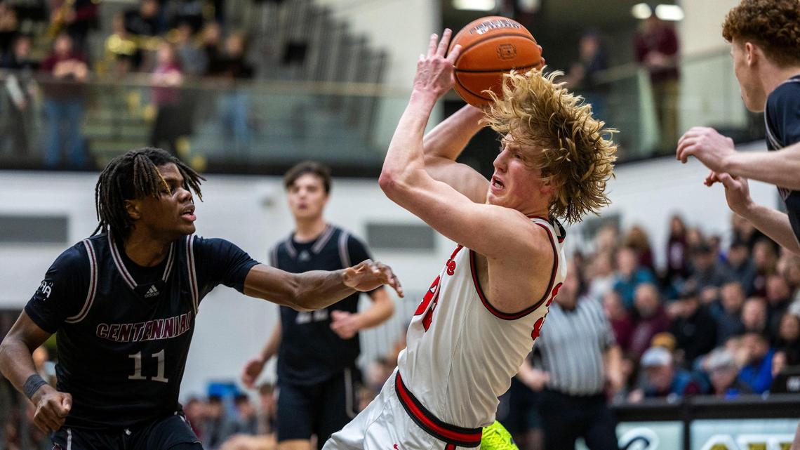 Owyhee senior Liam Campbell drives against Centennial but is called for an offensive foul in the 5A District Three boys basketball semifinals Saturday at Capital High School.