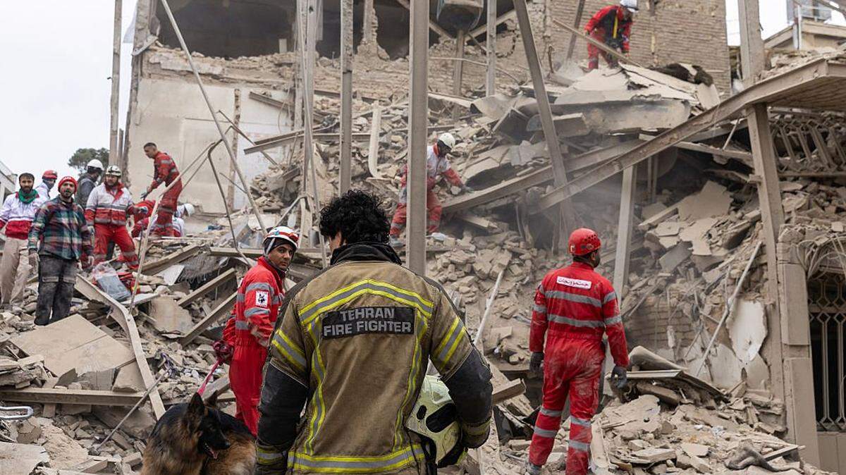 TEHRAN, IRAN - MARCH 16: Emergency crews search for people trapped in rubble following a strike on a residential building on March 16, 2026 in central Tehran, Iran. The United States and Israel continued their joint attack on Iran that began on February 28. Iran retaliated by firing waves of missiles and drones at Israel, and targeting U.S. allies in the region. (Photo by Getty Images)