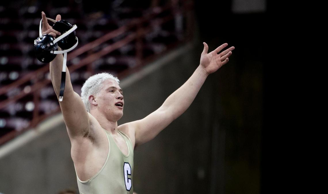 Capital’s Charley Hastriter, soaks in the applause after winning the 220-pound state title last season. The Oregon State signee is the top seed in the heavyweight division this year.