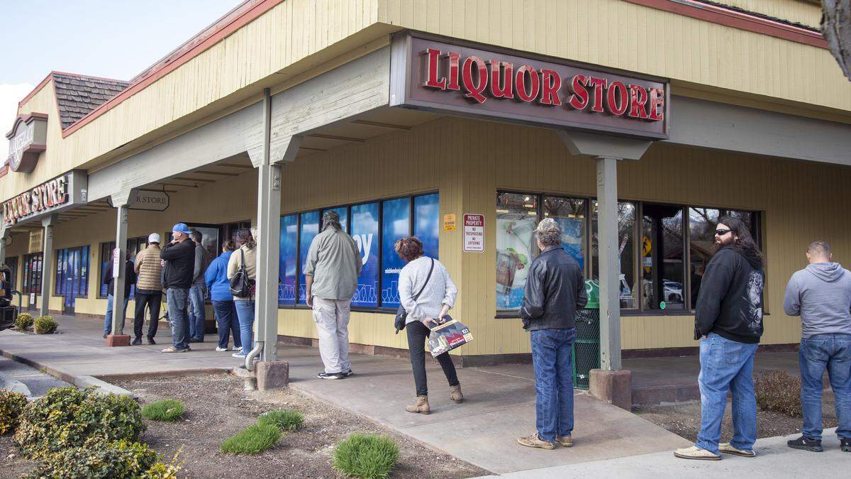 Patrons lined the sidewalk in front of the state liquor store at 17th and State streets, more or less practicing the required 6 feet of social distancing, late Wednesday, shortly after Gov. Brad Little ordered Idahoans to stay at home except for essential business.