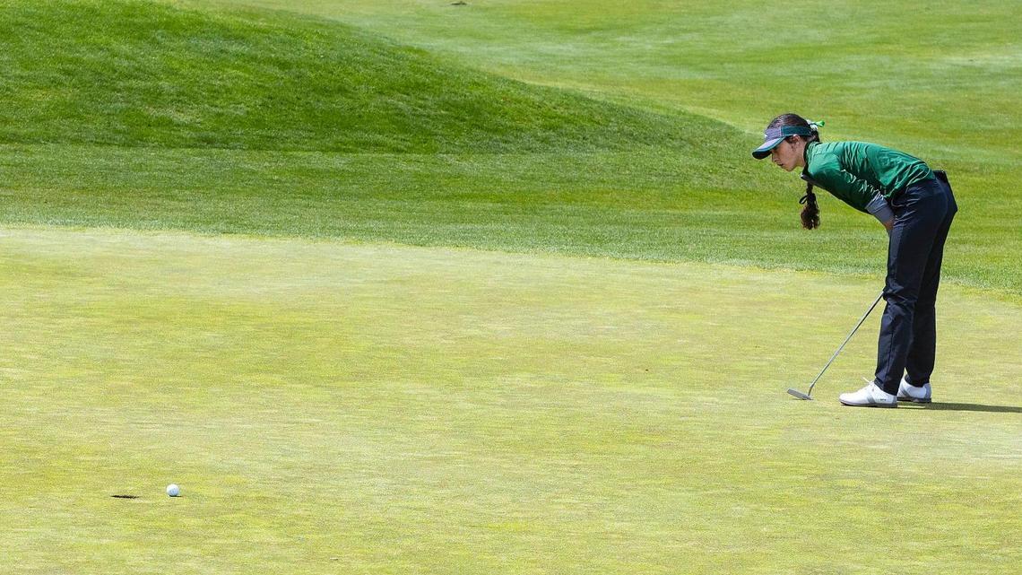 Eagle’s Brooke Patterson tries to will her putt into the hole at the 5A District Three girls golf tournament Tuesday at BanBury Golf Course in Eagle. Patterson won the individual title after finishing second twice in her career.