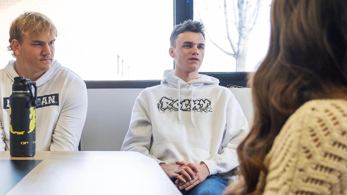 Rocky Mountain High School senior Jack Stone, 17, center, talks about the cell phone policy that was implemented at the beginning of this school year.