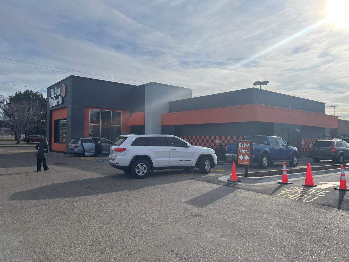 Vehicles wait at the drive-thru on Monday morning at Big Bun.