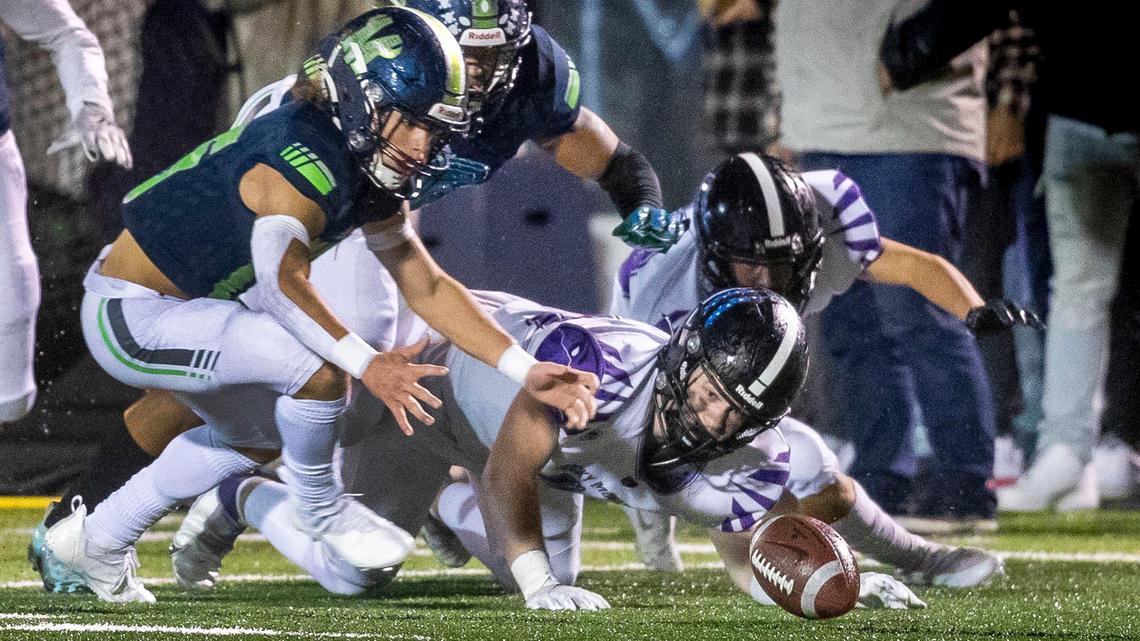 Mountain View sophomore Grayson Flatten pounces on a loose kickoff as Rocky Mountain’s Ty Page can only watch in the 5A SIC championship game Friday at Mountain View High in Meridian.