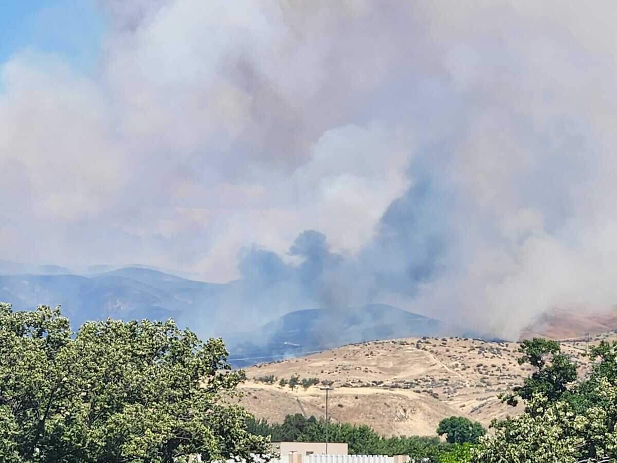 Smoke rises from the Claremont Fire in the Boise Foothills on Monday afternoon. The fire quickly grew to more than 300 acres.