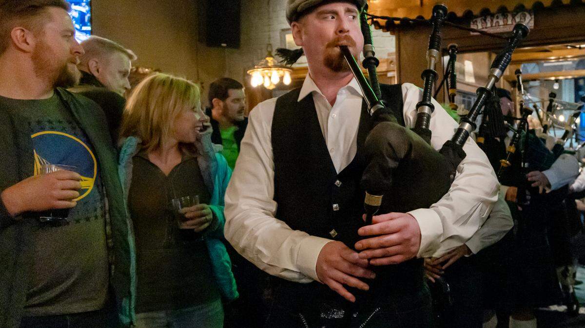 The Boise Highlanders play at Tom Grainey’s, a bar in downtown Boise, for St. Patrick’s Day in 2023. The band includes bagpipes, drums and dancers.