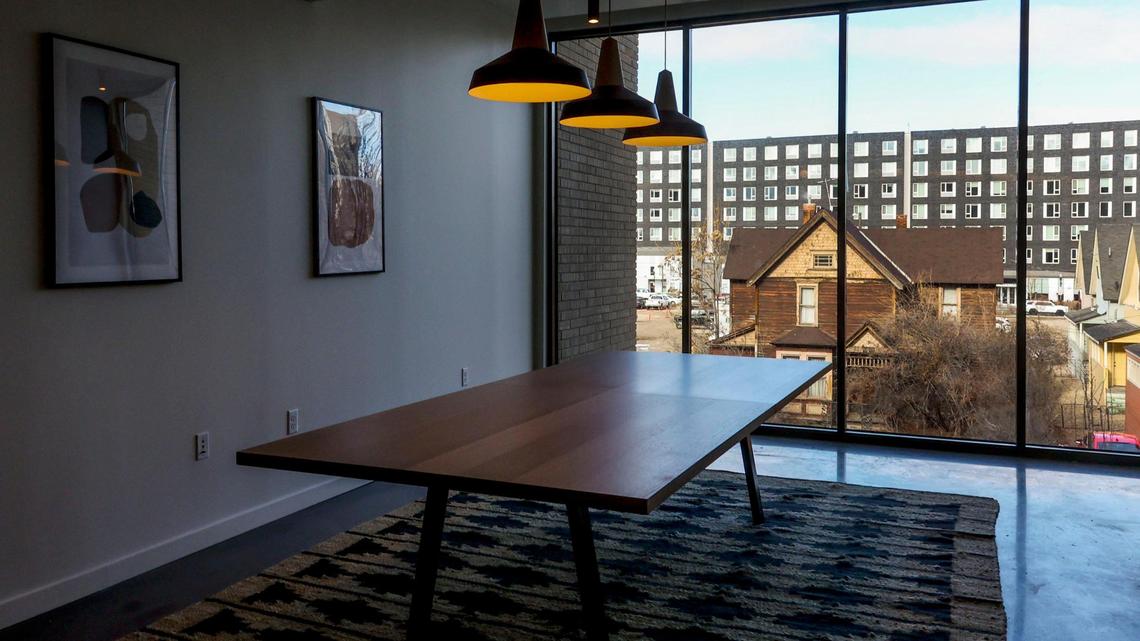 A view from a commons room at Hearth On Broad shows an early 1900s building still standing across 4th Street, and The Fowler apartments, whose developer also built Hearth On Broad.
