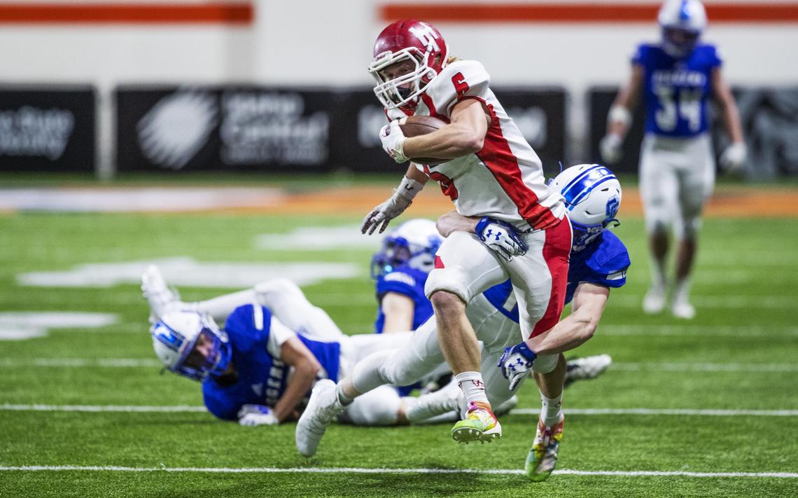 Homedale fullback Jacob Collett plows through Sugar-Salem’s secondary after a catch in the first quarter of the 3A state football championship Saturday, Nov. 23, 2019 at Holt Arena in Pocatello.