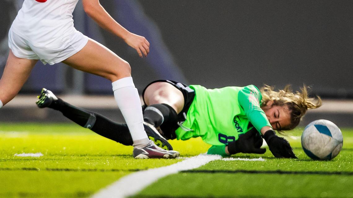 Rocky Mountain goalkeeper Bea Levi slides to stop the ball Monday against Boise. Levi made six saves for the shutout in Rocky Mountain’s 2-0 victory.