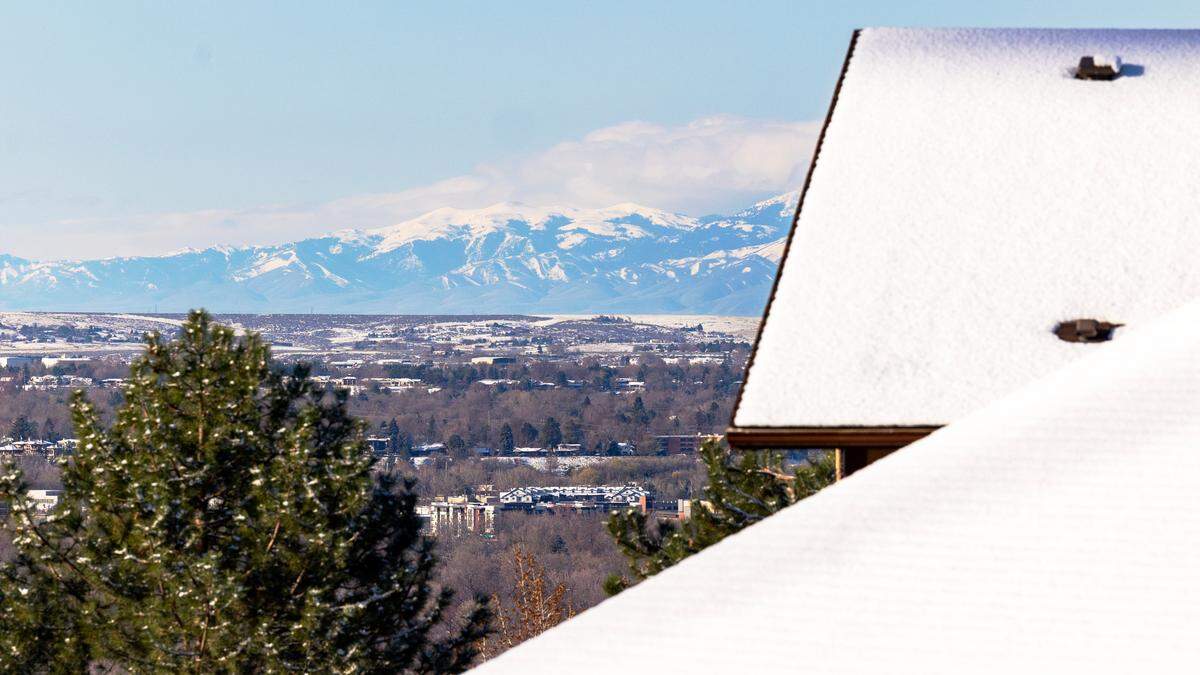 Snow tops the peaks of the Owyhee Mountains, seen from Boise, Thursday, April 13, 2023. Southern Idaho has seen record amounts of snow this year.