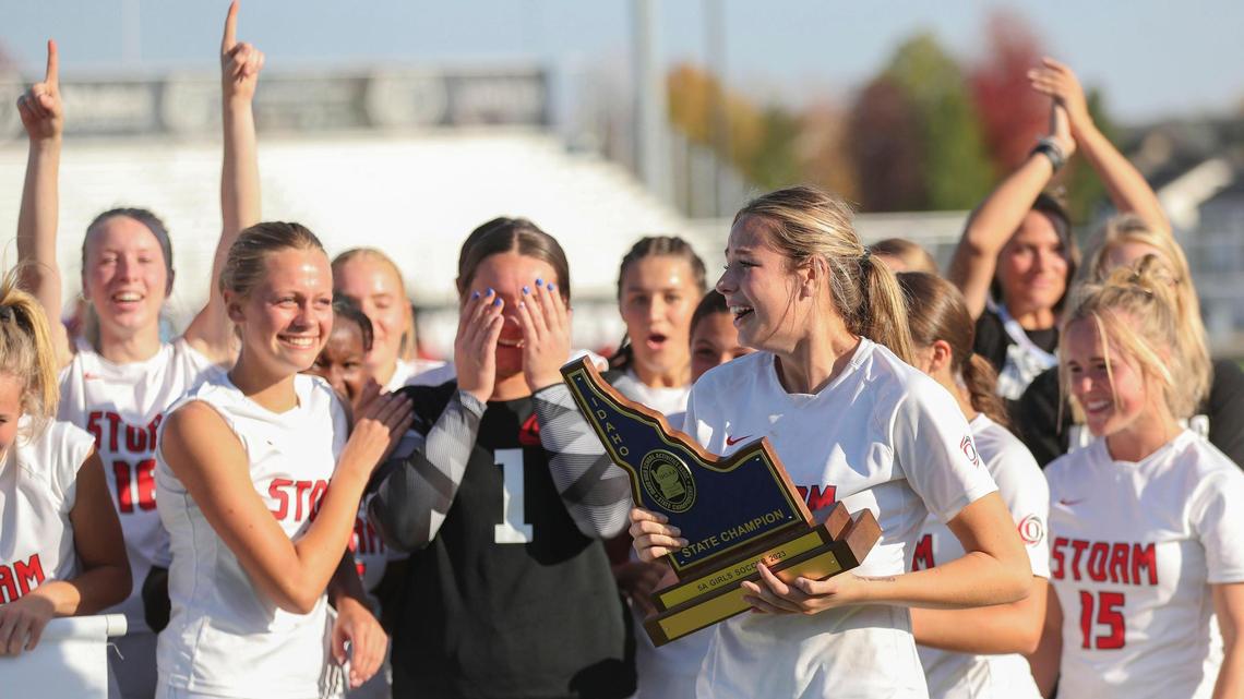 Owyhee celebrates with the state championship trophy last fall.