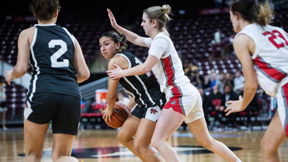 Columbia junior Violet Soto passes to teammate junior Ellie Robertson during a 47-32 loss to Sandpoint in the 4A girls basketball state semifinals Friday at the Ford Idaho Center in Nampa.