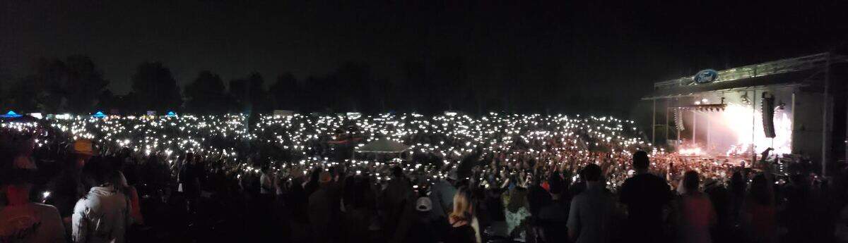 Concertgoers light up Ford Idaho Center Amphitheater with their phones on Saturday night.