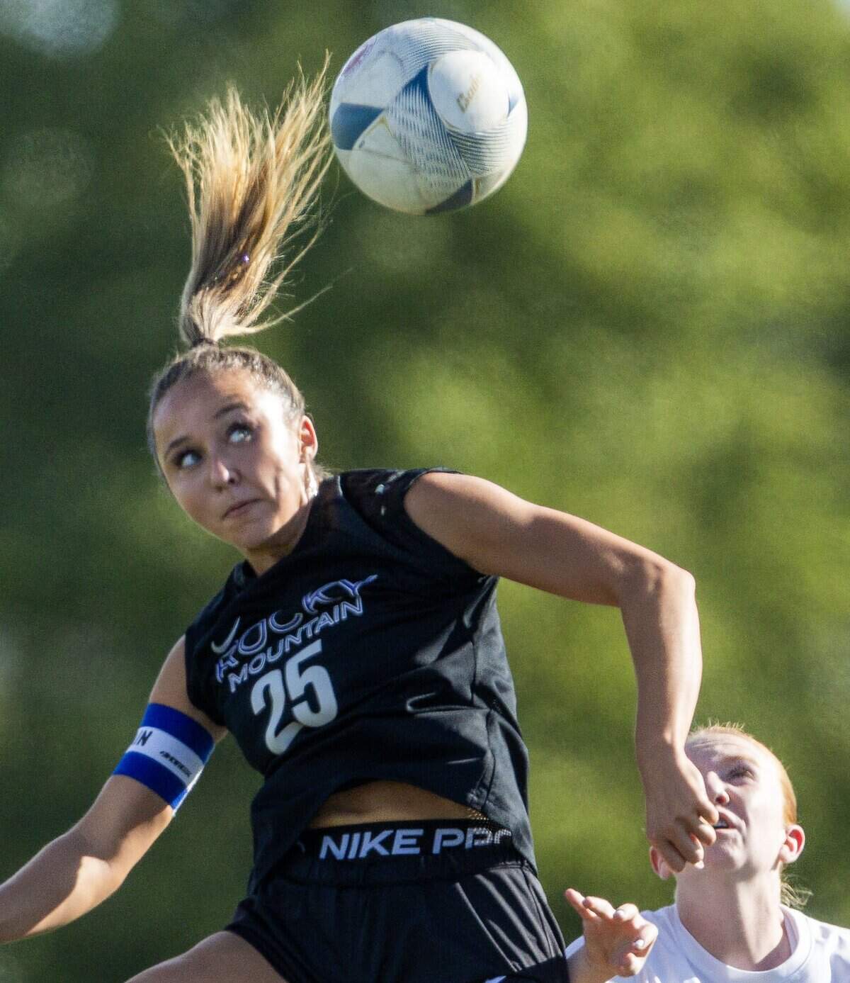 Rocky Mountain forward Campbell Wilson leaps for a header against Eagle in the 6A girl's soccer state tournament at Rocky Mountain High School in Meridian, Thursday, Oct. 23, 2025.