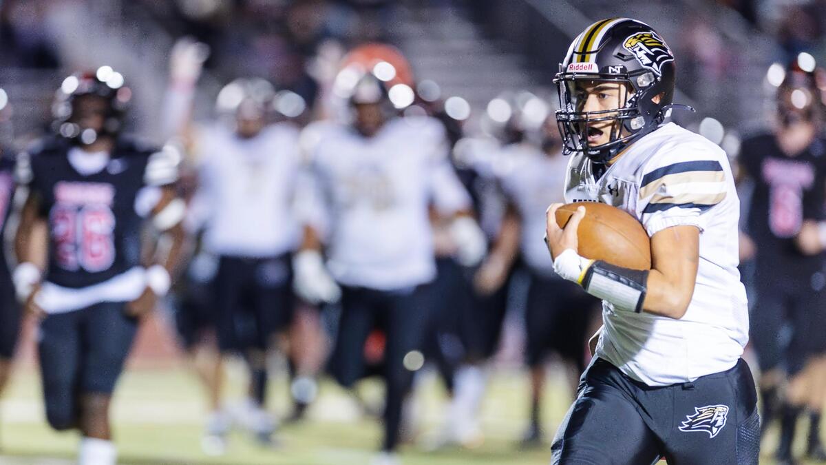 Kuna freshman quarterback Lino Senio breaks free on a naked bootleg for a 20-yard touchdown run in the second quarter Friday.