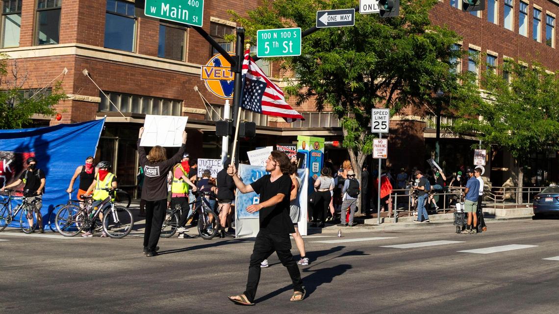 Demonstrators march from Boise City Hall to near the site of a police shooting at the corner of 5th and Main streets in downtown Boise on June 30 to protest the death of Payton Wasson.