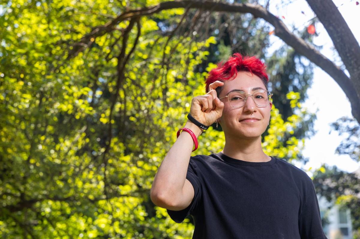 Xander Trexler, 17, poses near a walking trail by his Eagle home.