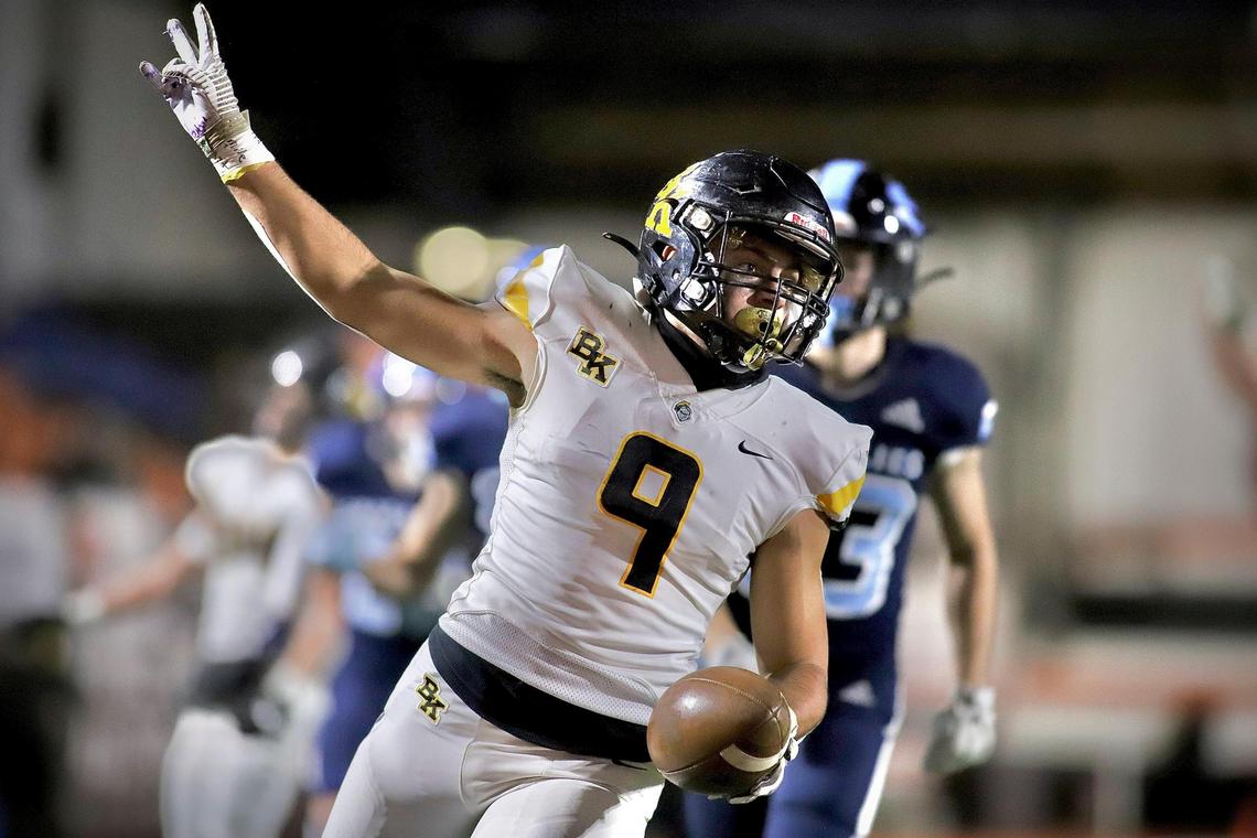 Bishop Kelly senior Zachary Jacobs celebrates a second-half touchdown against Skyline in the 4A state championship game in Pocatello. Skyline won 50–35 for its third straight title.