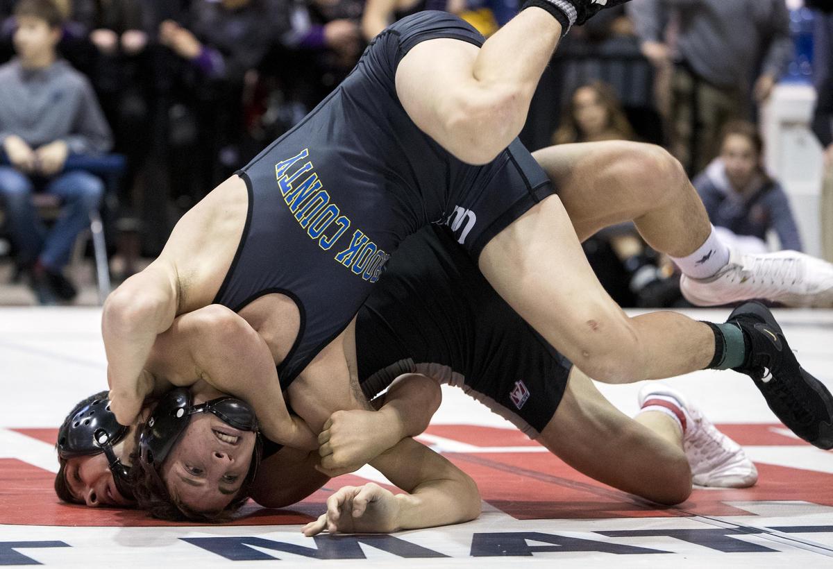 Ridge Lovett of Post Falls gets an advantage on Zachary Mauras from Crook County, Ore. during the 132-pound championship match in at Rollie Lane Invitational Saturday, Jan. 5, 2019 at the Idaho Center in Nampa. Lovett pinned Mauras to win the title.