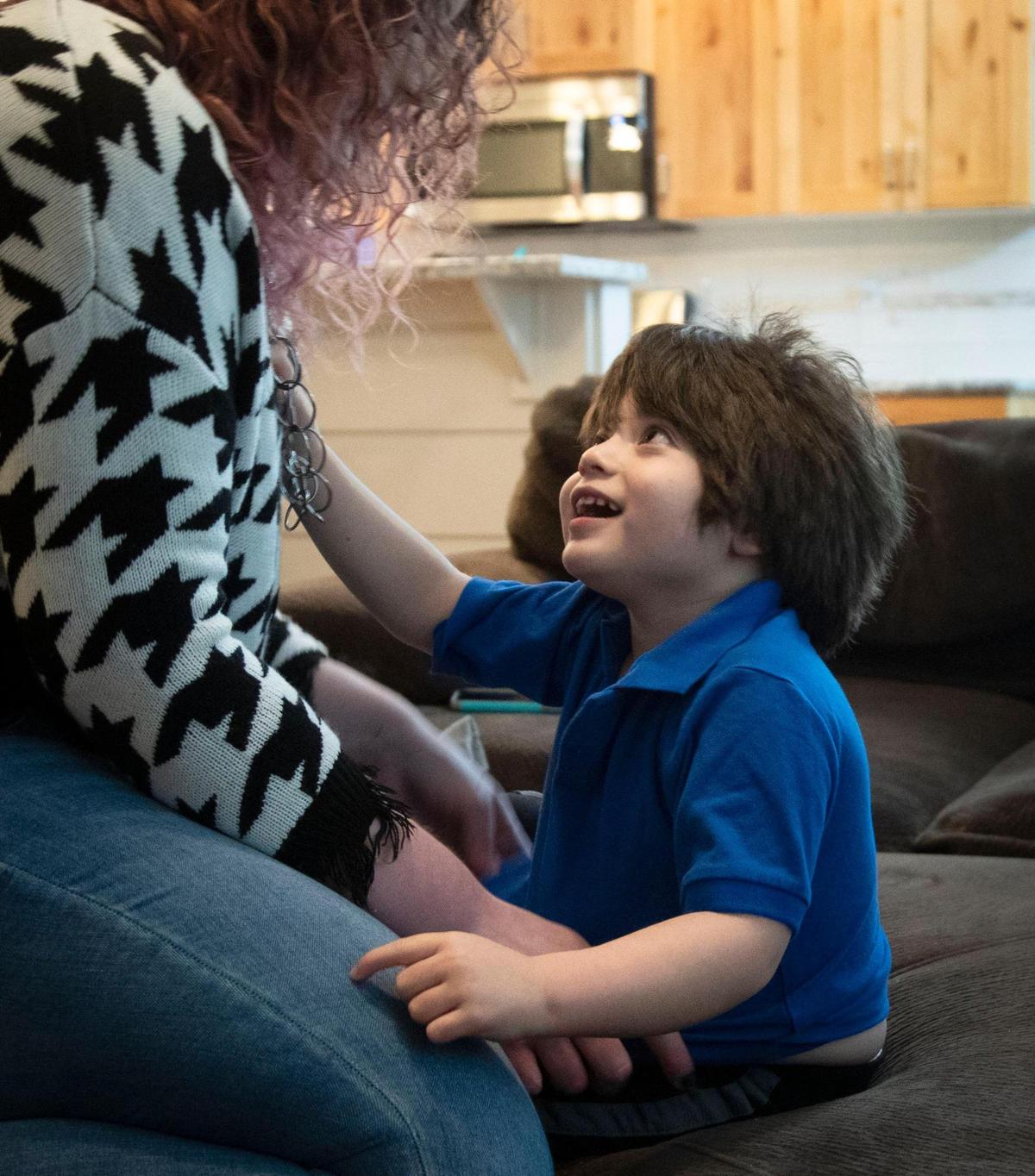 Mikayla Ririe’s 4-year-old son Walter plays with her at their Boise home. He was born with Angelman syndrome, a genetic disorder causing developmental disabilities.
