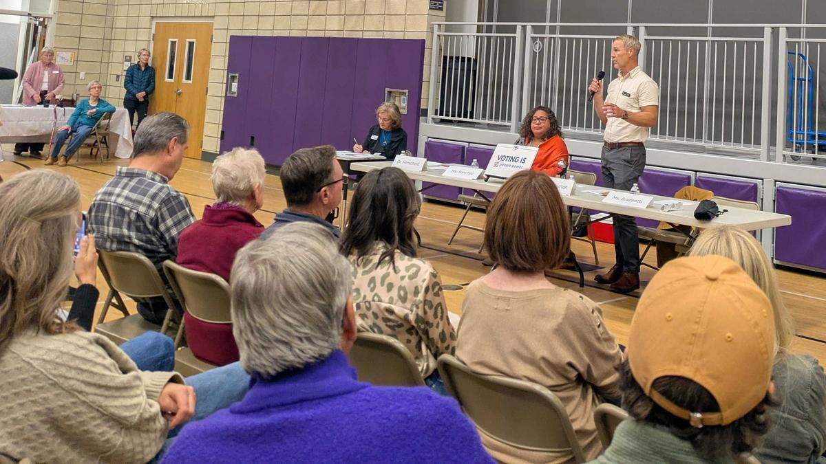 Boise City Council Member Jimmy Hallyburton answers a question at a candidate forum Thursday. Former Council Member Lisa Sánchez sits next to him. Lynn Bradescu, the third candidate, did not attend the forum, citing illness.