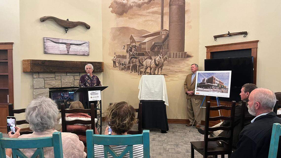 Millie Davis, the daughter of Dallas Harris, celebrates her family’s donation to the Boise School District of a site to build a new elementary school on March 15, 2022.