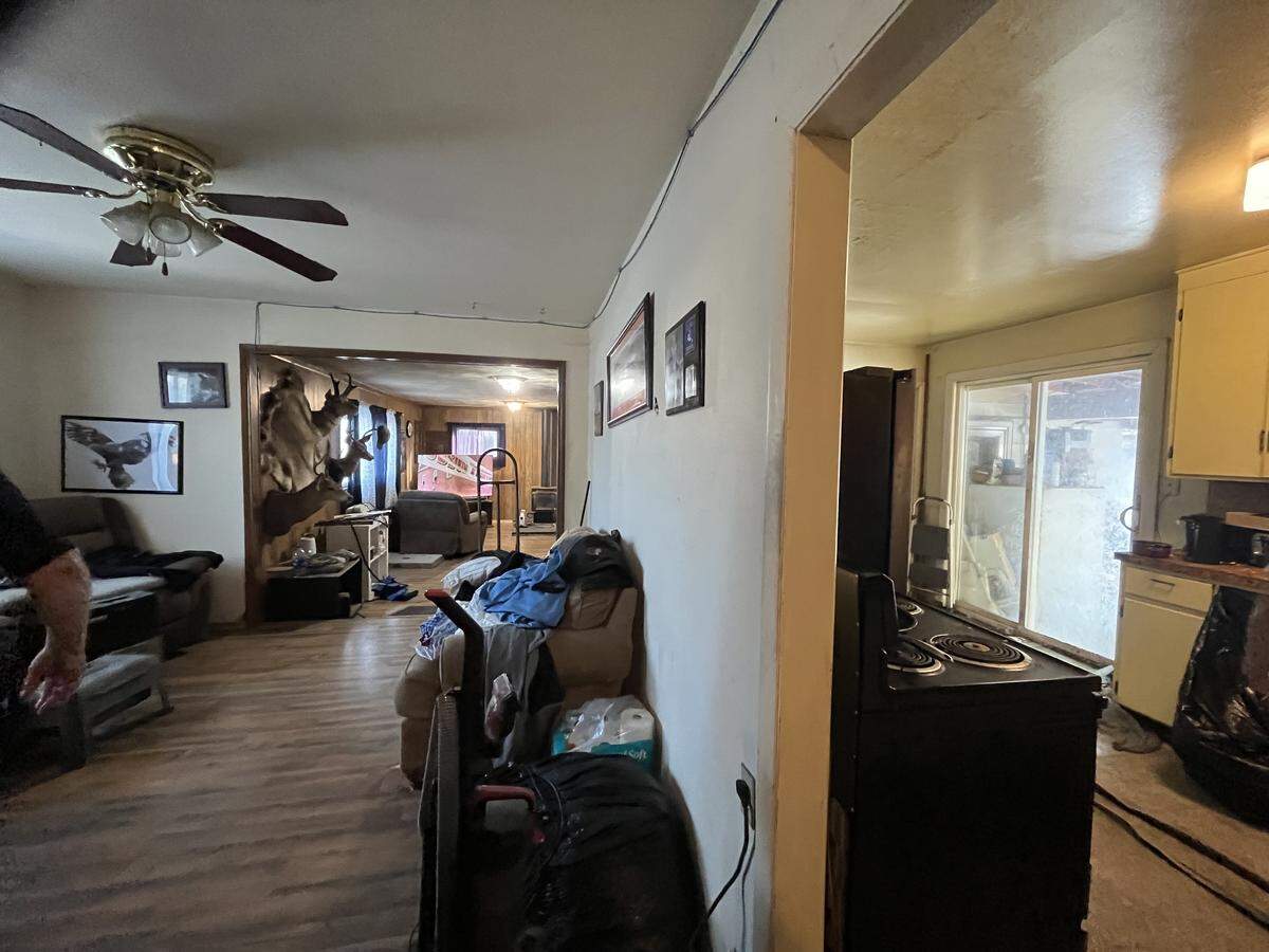 A “before” photo shows the living room of a Boise home that won HomeVestors of America’s Ugliest House of the Year contest in 2025.