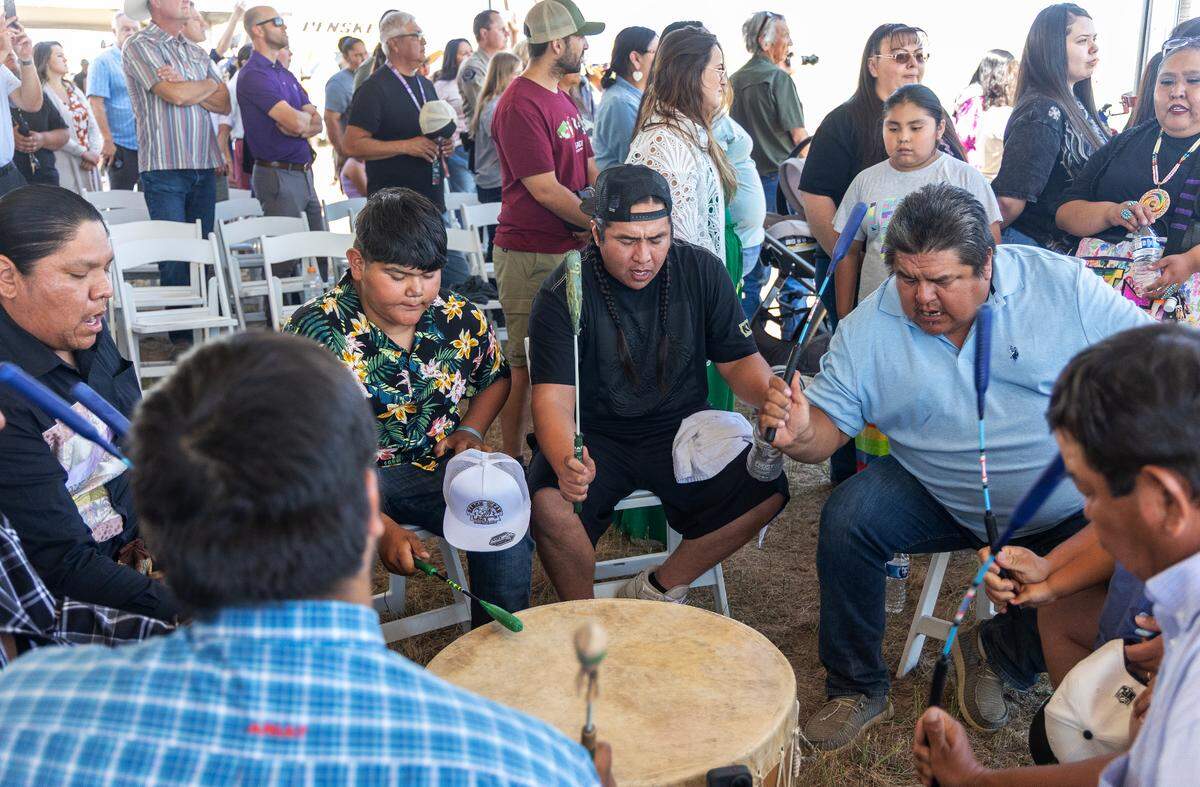 Tribal members gather for a drum circle.