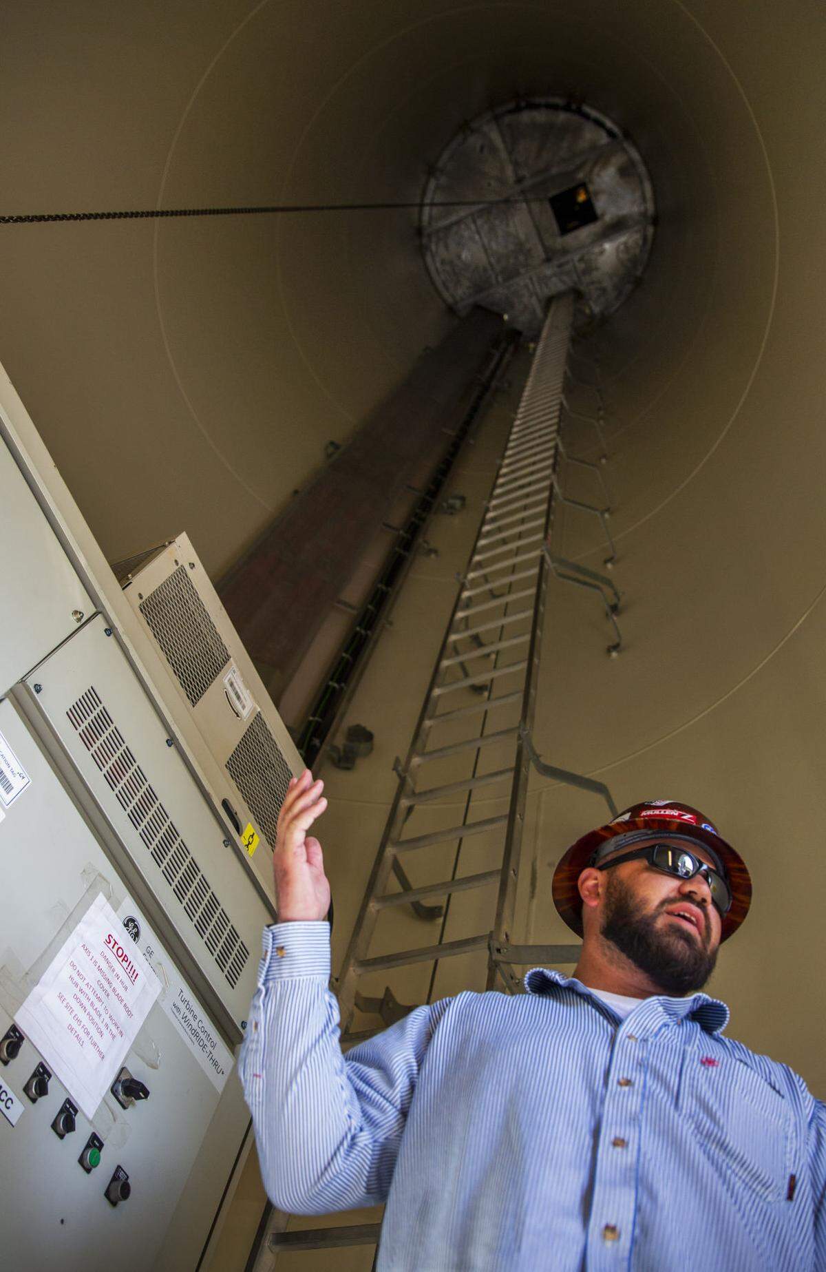 Facility Manager Keith Johnston, standing inside a wind turbine, explains how the turbine works May 24 at Idaho Wind Partners' Yahoo Creek project south of Hagerman.
