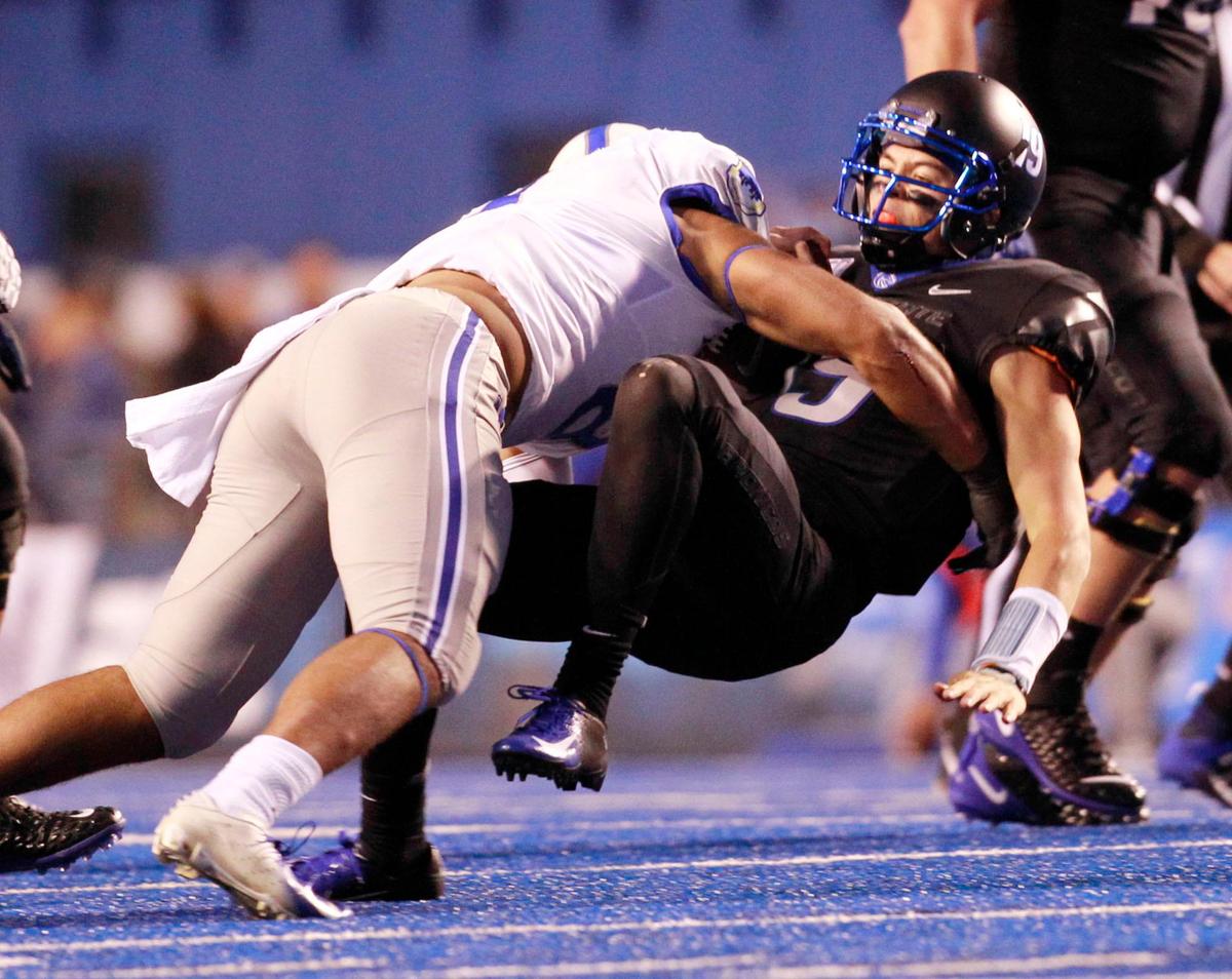 xxx (8) takes down Boise State quarterback Hank Bachmeier (19) in the first half at Albertsons Stadium on Friday Sept. 20th, 2019.