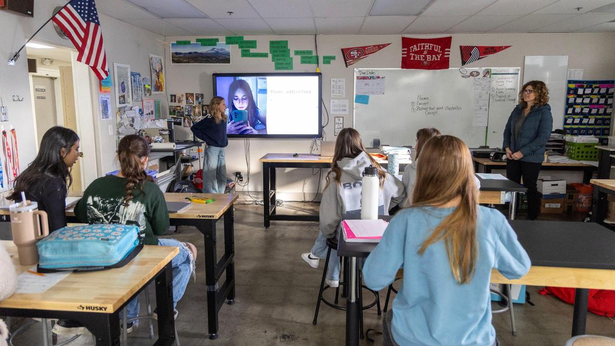 Middle school students in a health class take turns presenting their research at Cole Valley Christian School in Meridian.