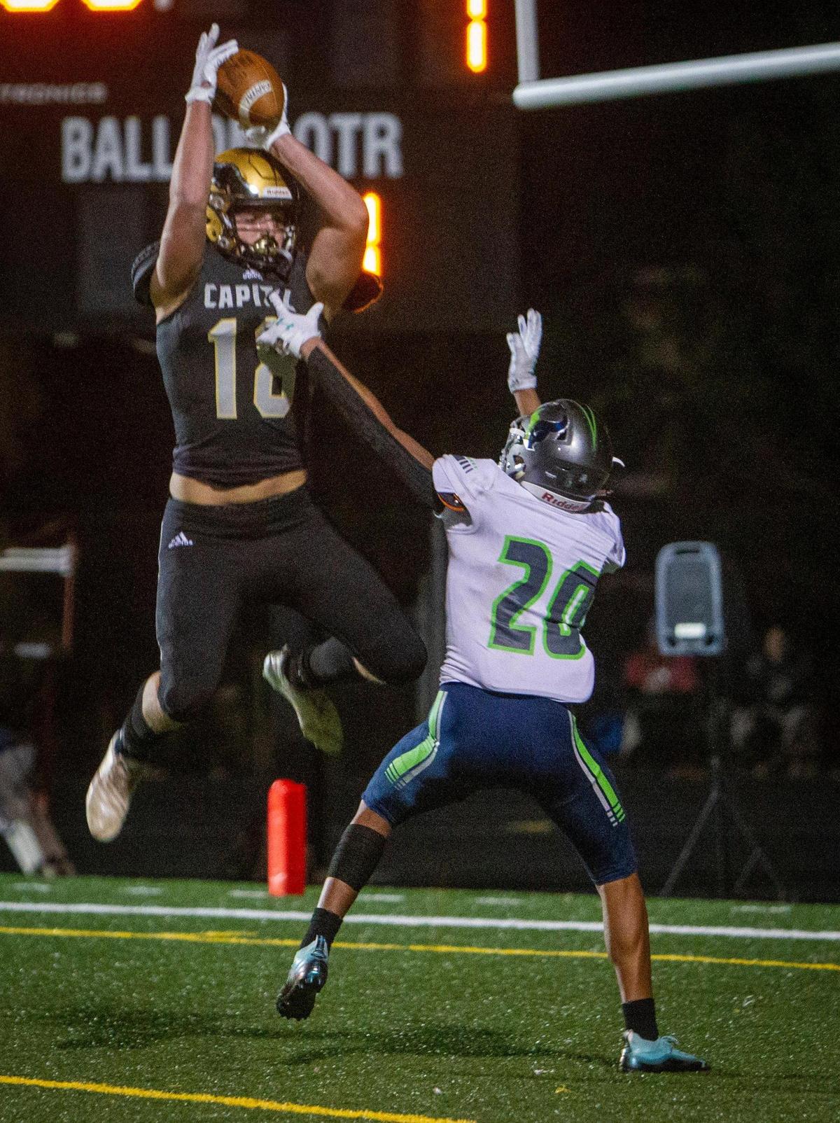 Capital tight end Kody Walk uses his size and leaping ability to haul in a two-point conversion in the 5A state quarterfinals last fall.