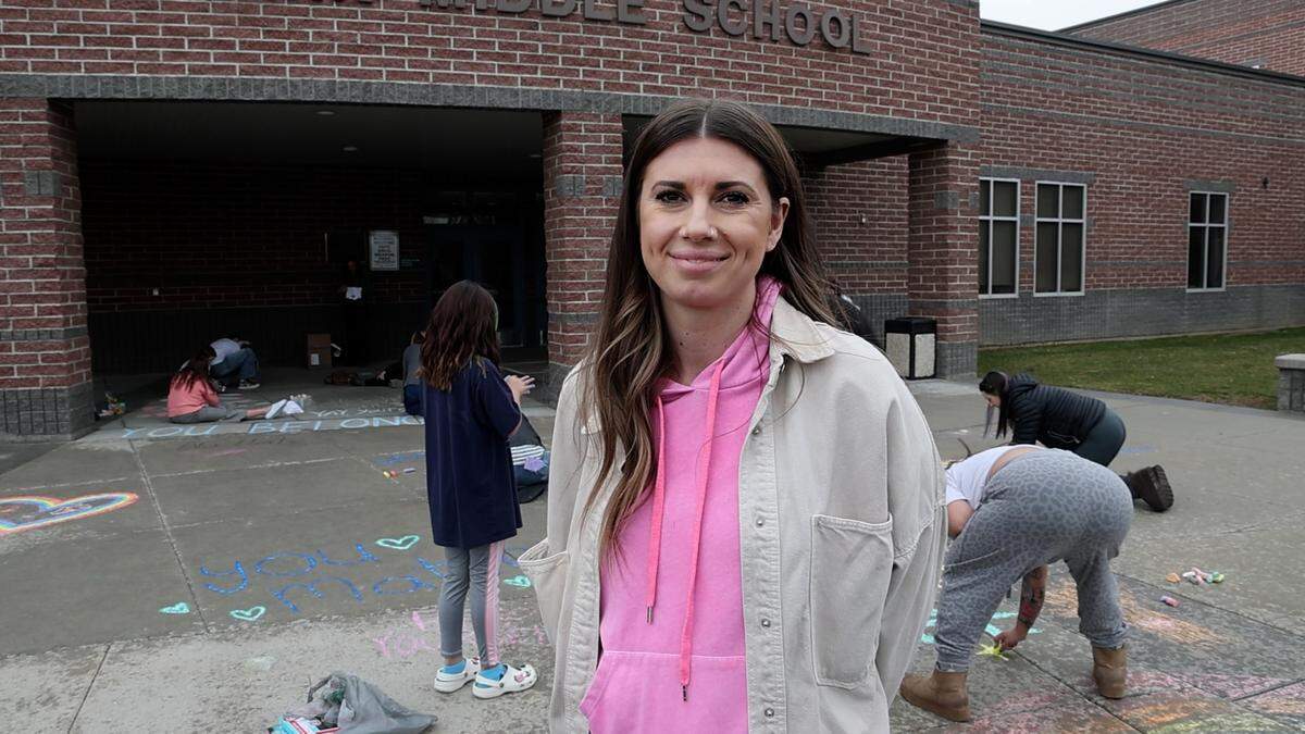 Inama and others gathered at Lewis and Clark Middle School on Sunday, March 23, to chalk sidewalks and parking lots with the phrase “Everyone is welcome here.” Many gathered at the school district office in Meridian to do the same.